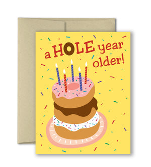 Cute birthday card with fun stacked donuts and candles.